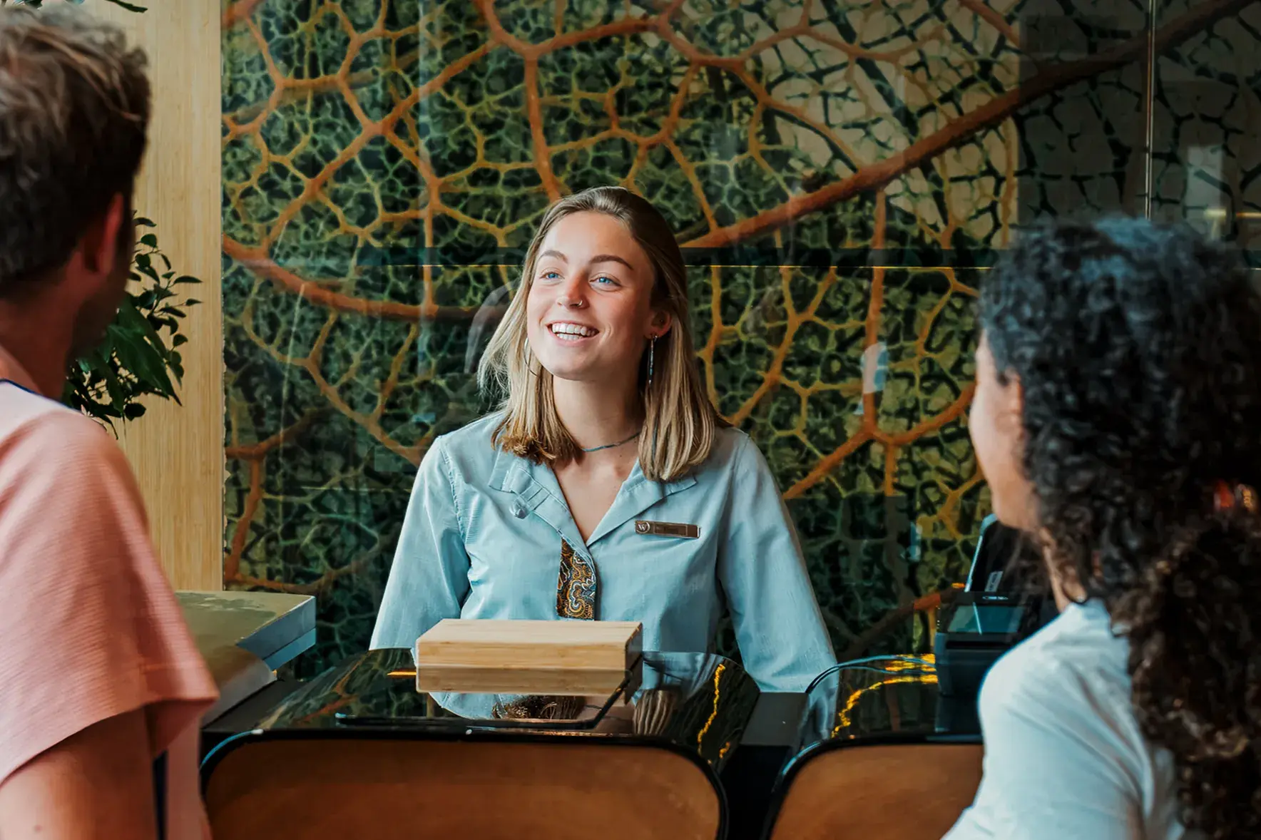 Hotel receptionist welcoming guests